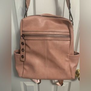 Beautiful pink/mauve backpack purse.